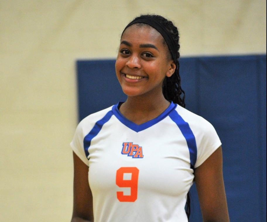 #9 Roberson poses for a photo after a sweep win home game against ACE Charter school.