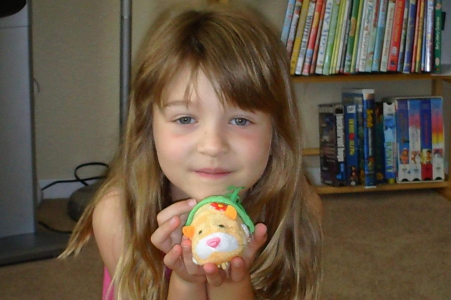 Taken+in+2010%2C+a+five-year-old+Alexandra+shows+off+her+Zuzu+pet+and+unbrushed+bangs%2C+the+same+year+Swift+debuted+bangs+of+her+own.