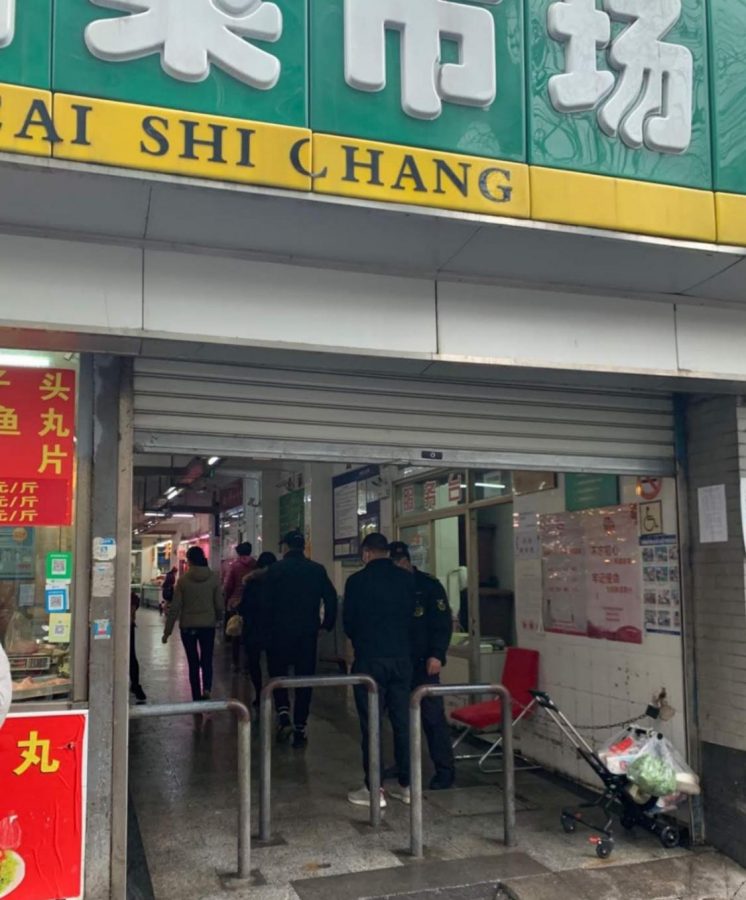 Sanitation officers are stationed at the doorway to a vegetable market in Shanghai, China.
Courtesy of Wang Xiu Ying (name changed)