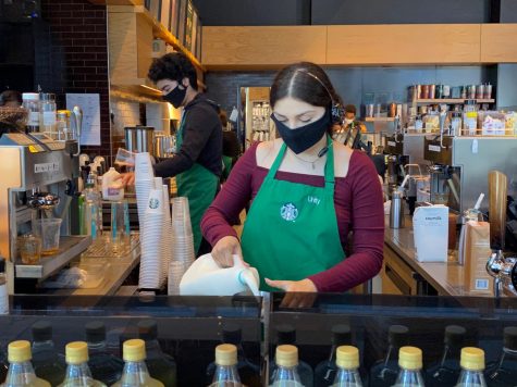 Working beside her coworker Kristian Shirallie, Unity Aldaco makes a drink for one of the mobile orders. According to Aldaco, mobile orders are typically larger orders and include more than one drink or food item.