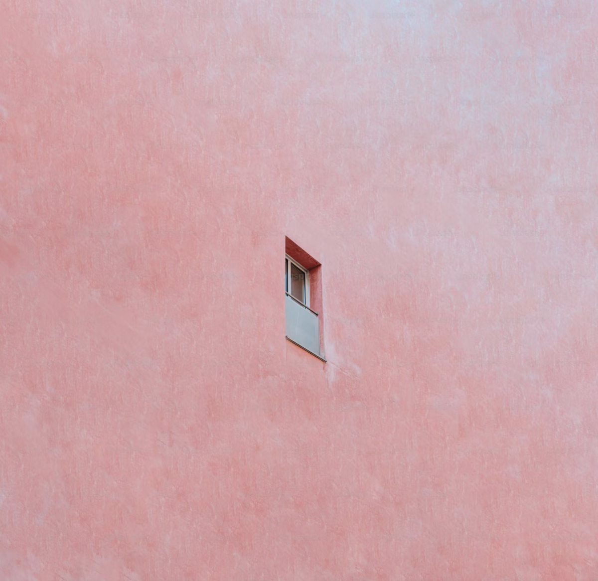 A single window in the middle of a pink wall, Photo courtesy of A.C on Unsplash